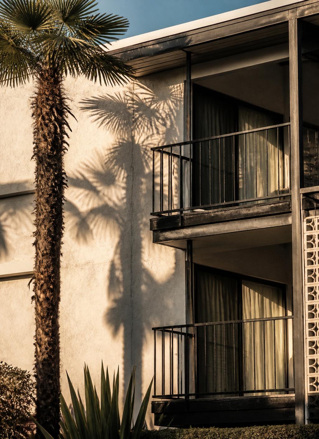 Aerial view of Manhattan Beach multifamily buildings at sunset